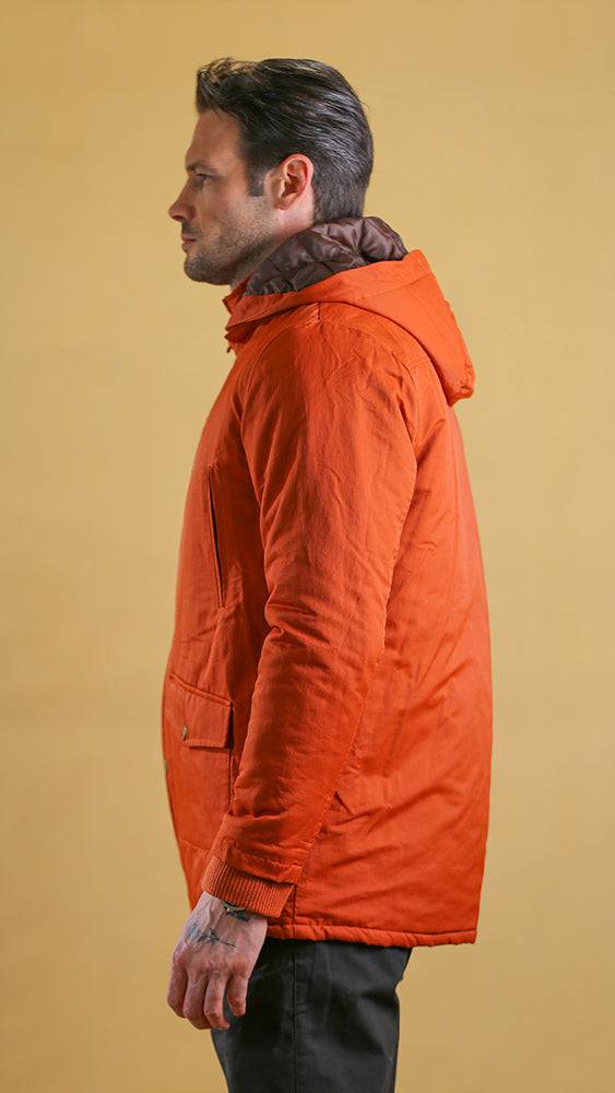 Men's orange bomber jacket with hood, side profile view