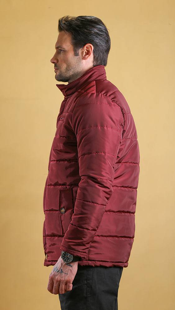 Crimson quilted bomber jacket side view with high collar and flap pockets, snap front