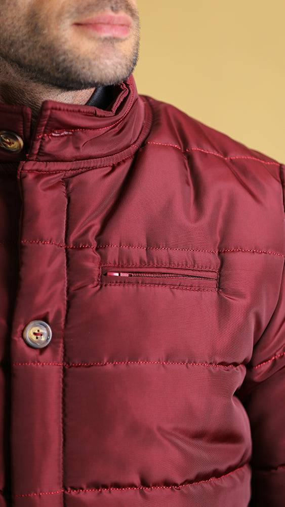 Crimson bomber jacket close-up of high collar stitching and snap button placket