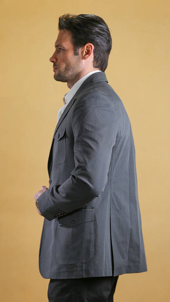 Men's dark asphalt blue-gray bespoke blazer, side profile with flap pocket and notch lapels