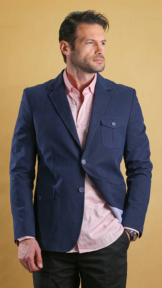 Men's navy bespoke blazer with flap chest pocket and two-button front, side view