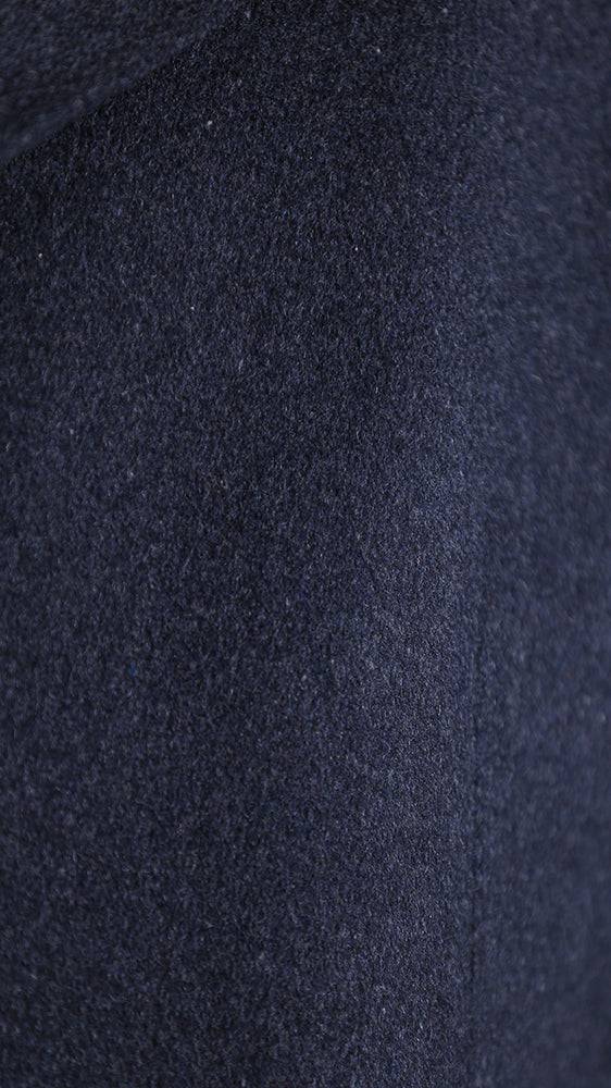 Overcoat fabric close-up with dark heathered texture