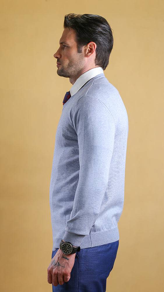Powder blue v-neck sweater, side view with long sleeves and ribbed trim