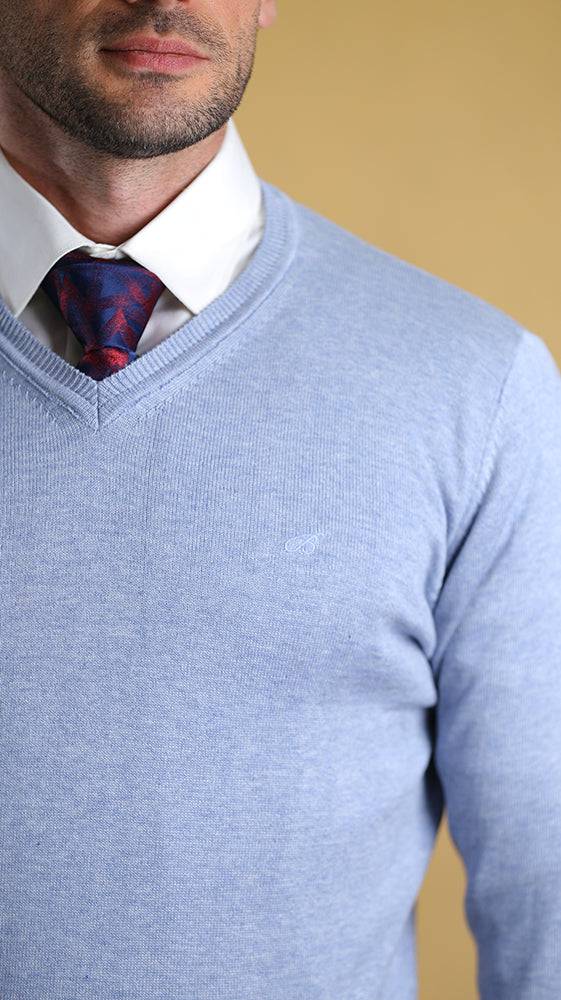 Powder blue v-neck sweater close-up showing knit texture and ribbed collar