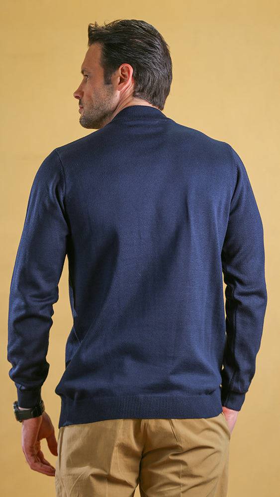 Cobalt blue crewneck sweater, back view with ribbed cuffs and hem.