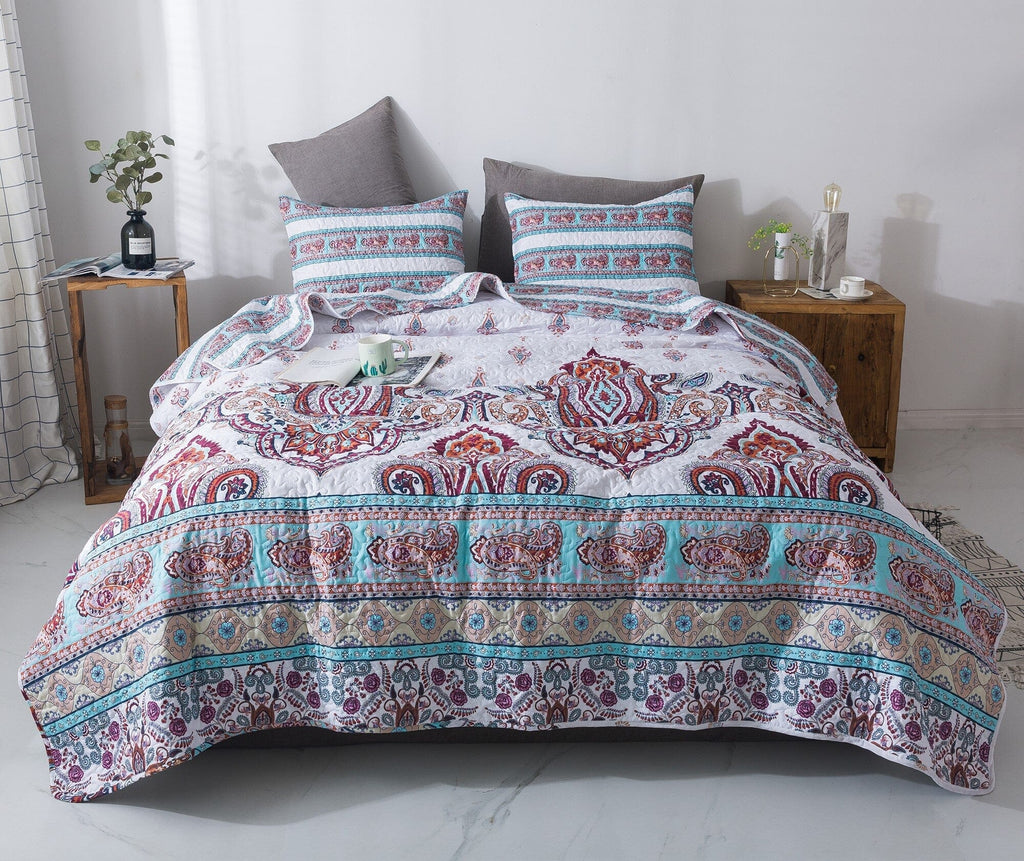 White paisley quilt set with blue border and burgundy medallion motifs, includes two shams