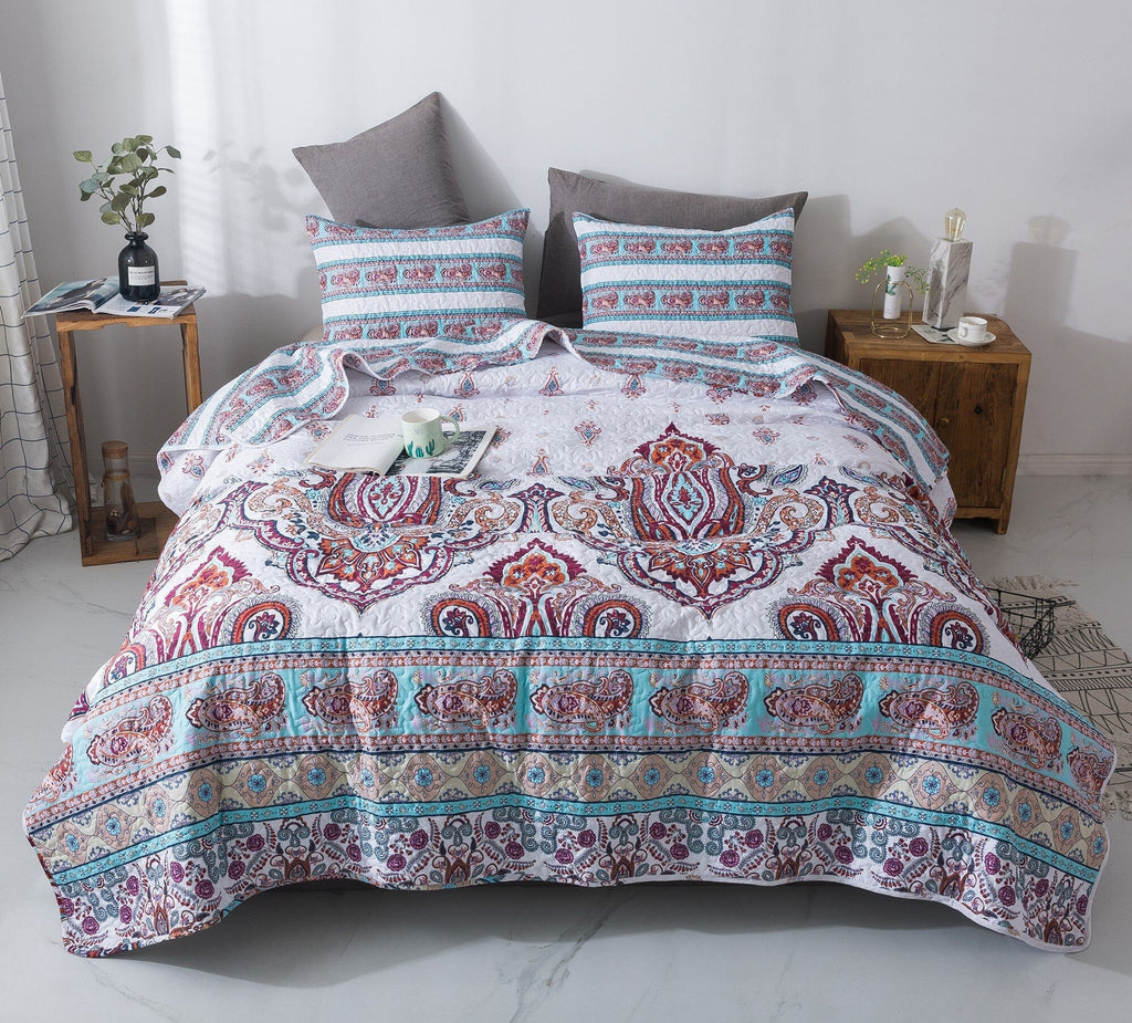 White quilt set with blue stripe border and burgundy-orange paisley medallion, two shams