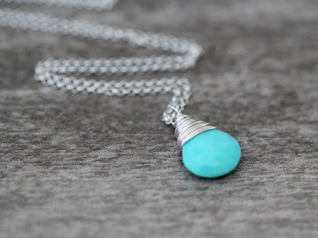 Turquoise solitaire pendant necklace with light metal wire wrap and short chain