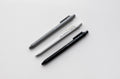 3-pack black and gray ballpoint pens with plastic clips and visible barrel text