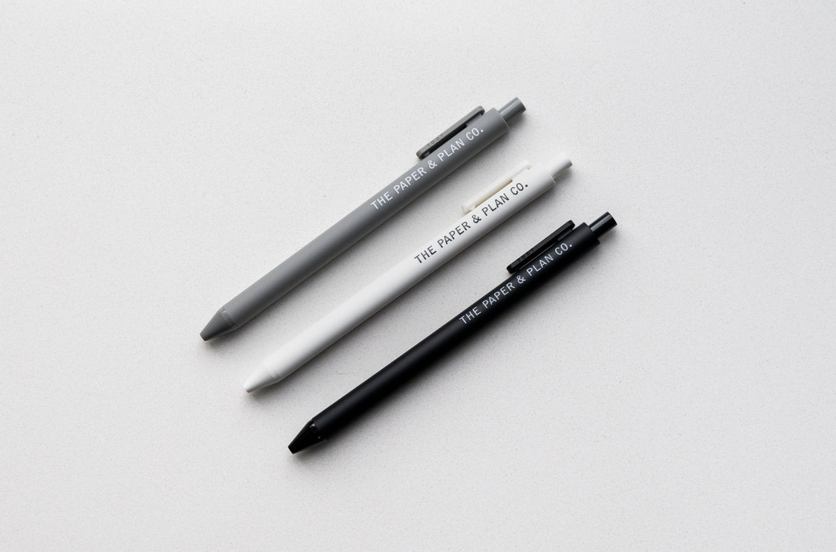 3-pack black and gray ballpoint pens with plastic clips and visible barrel text
