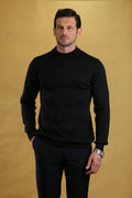 Black crewneck knit sweater with long sleeves and ribbed cuffs and hem