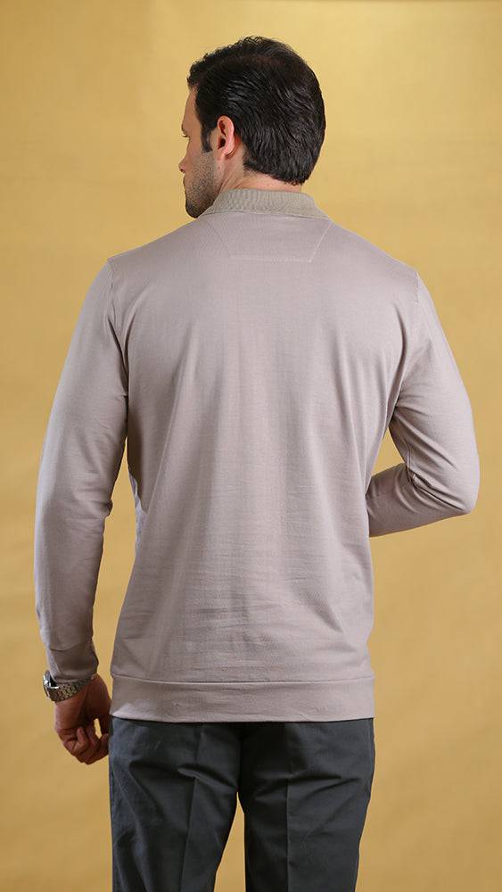 Cream long-sleeve polo shirt shown from back with neat collar