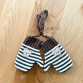 Kids winter mittens with dark gray and white stripes, bear patches, and tie strings