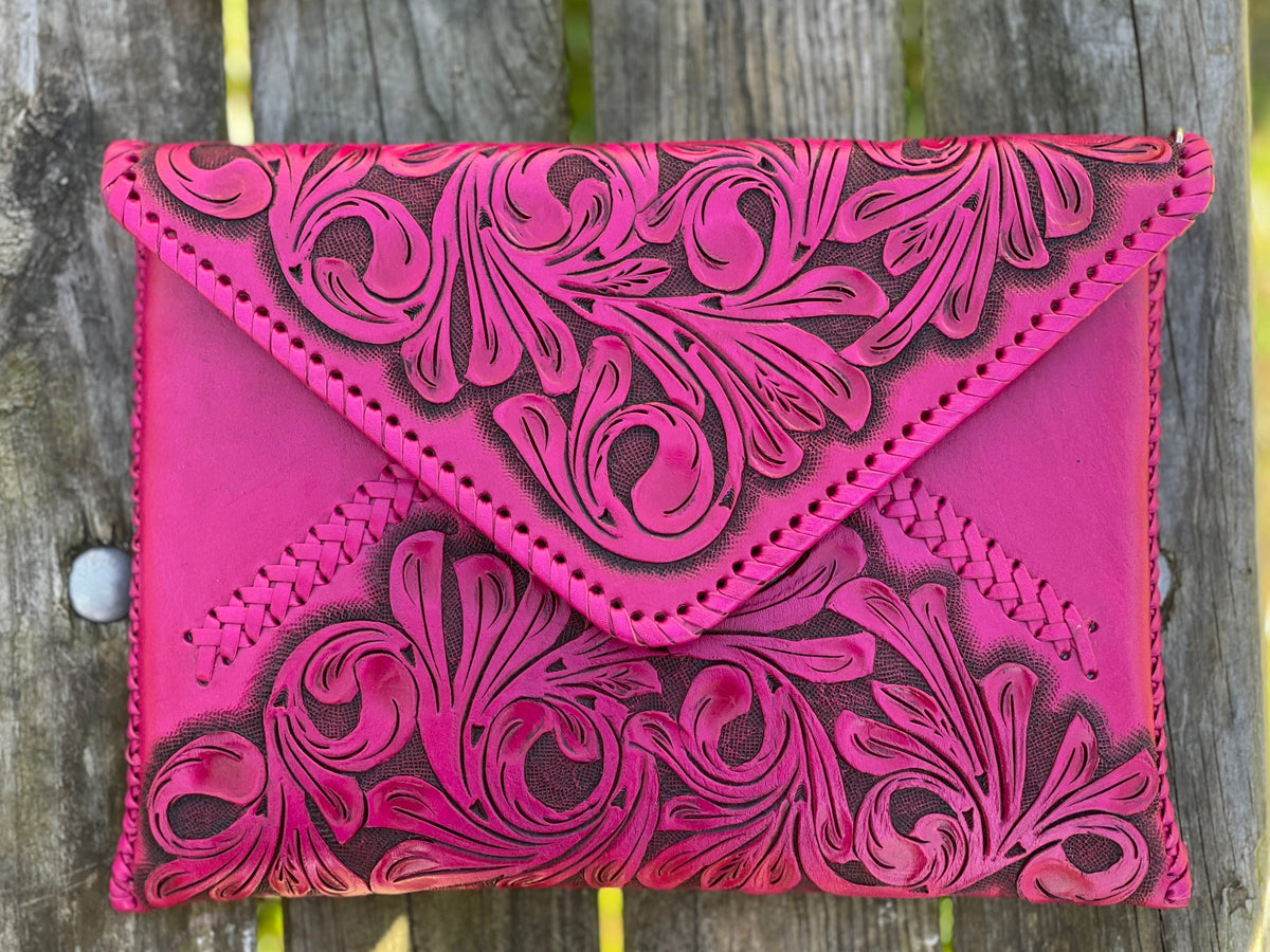 Hand-tooled leather crossbody & clutch bag, hot pink with carved floral emboss and crossbody strap