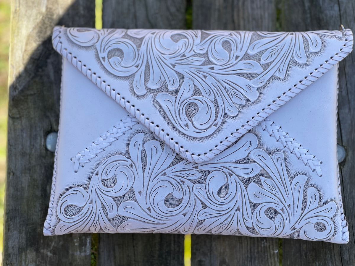 Hand-tooled leather crossbody & clutch bag, pale gray with floral emboss and decorative stitching
