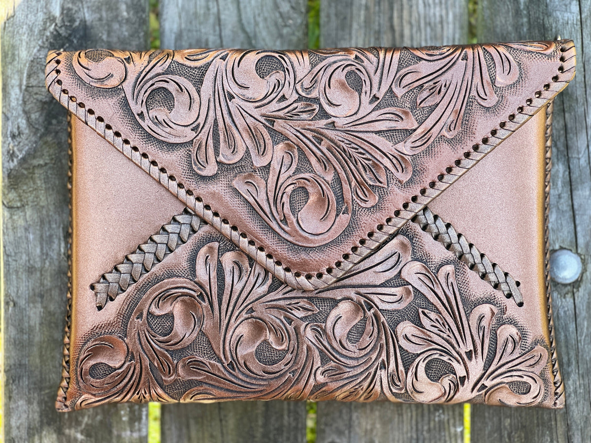 Hand-tooled leather crossbody & clutch bag, tan with dark floral emboss and stitched edges