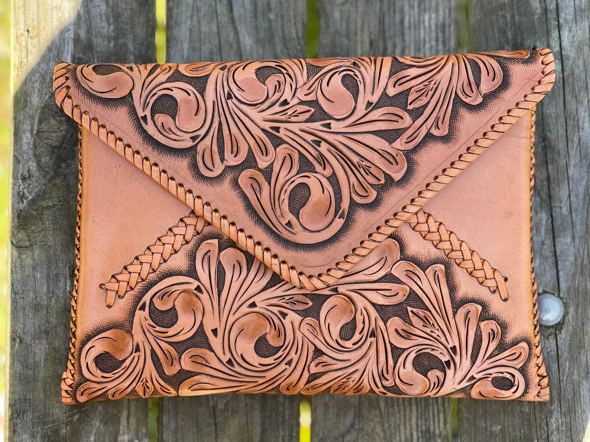 Hand-tooled leather crossbody clutch bag, light tan with carved floral panel