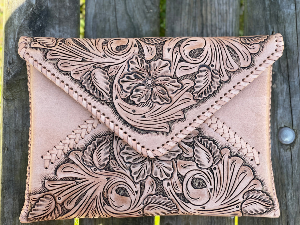 Hand-tooled leather crossbody clutch bag, light tan with ornate floral tooling front