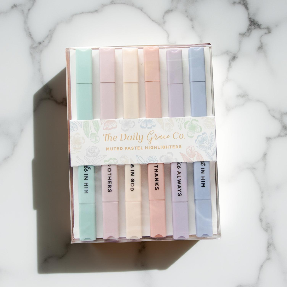 Muted pastel highlighter set in a clear-top box with six colored markers