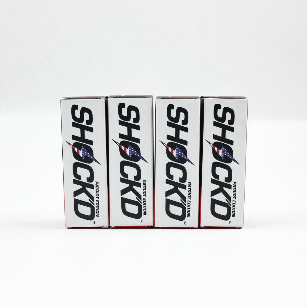 Set of Shock'd golf ball boxes on a line, white packaging with blue rocket logo