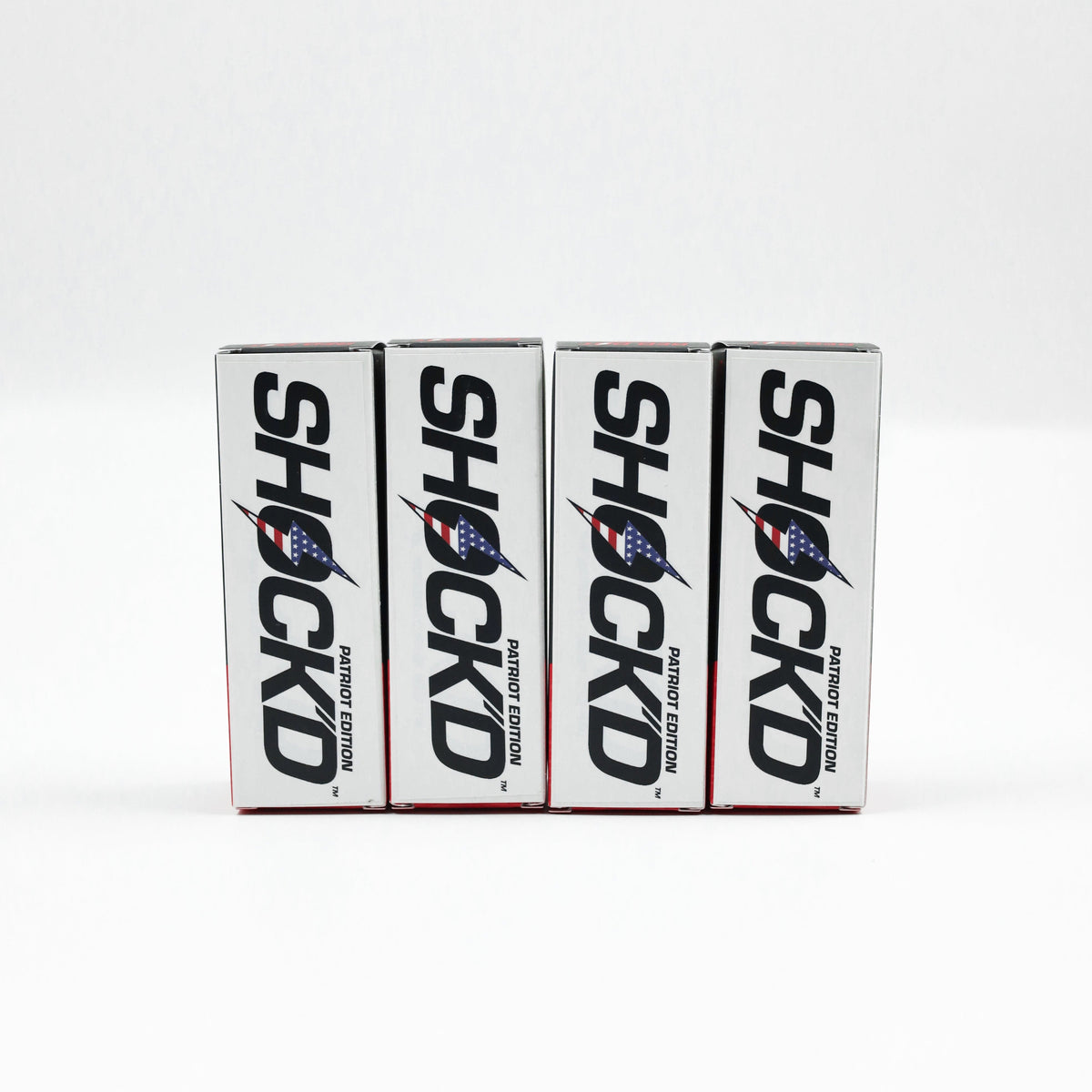 Set of Shock'd golf ball boxes on a line, white packaging with blue rocket logo