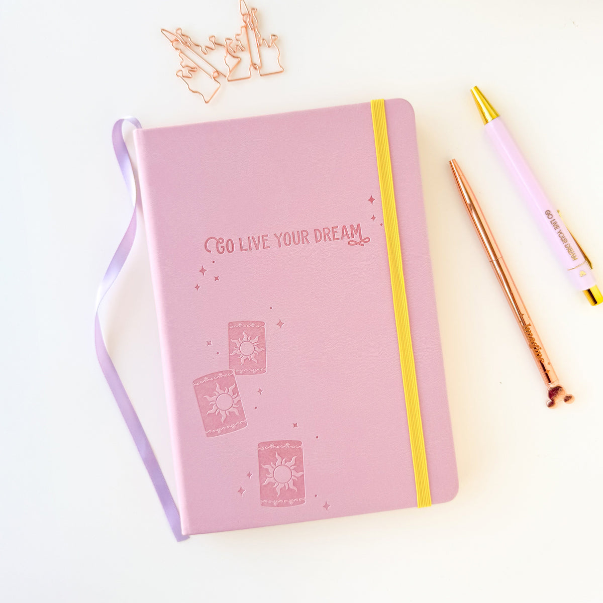 Pink embossed dream notebook with lavender ribbon and yellow elastic strap