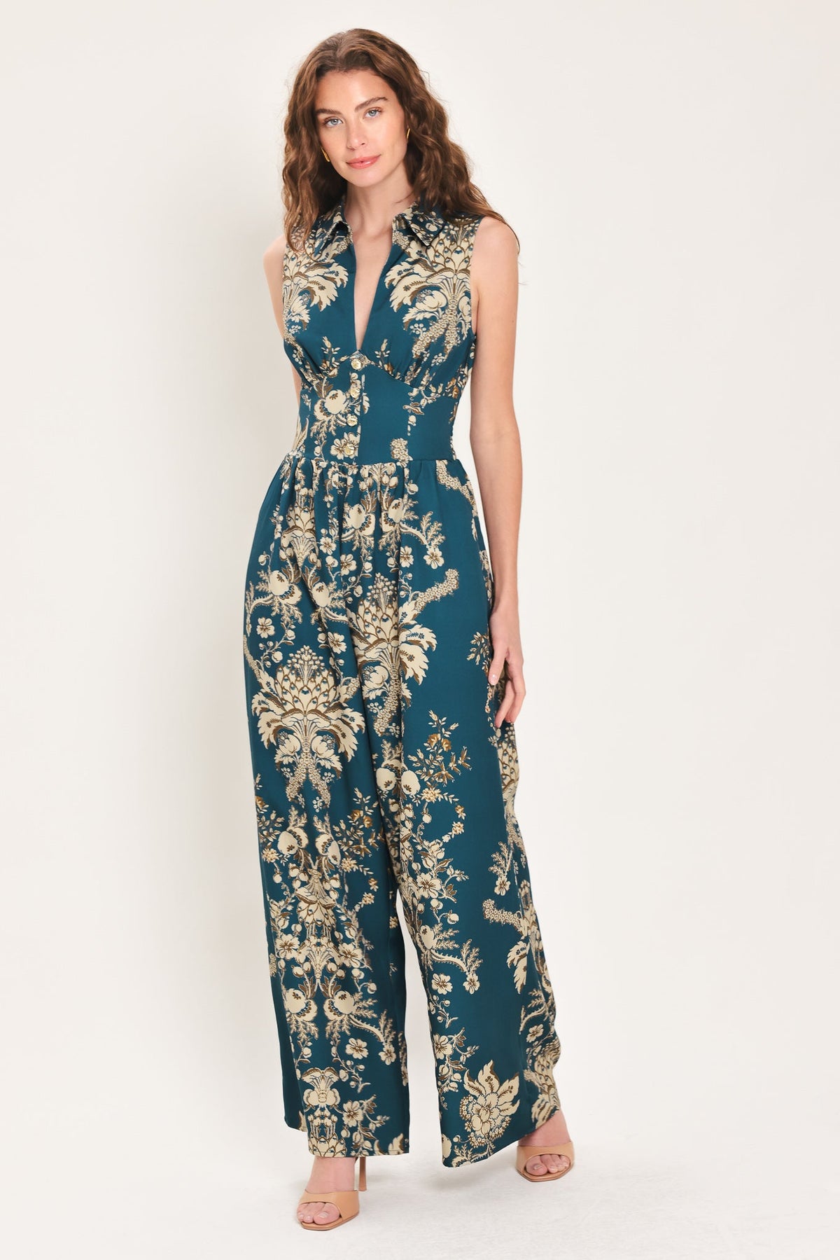 Teal printed collared jumpsuit with sleeveless V-neck and wide-leg floral pattern