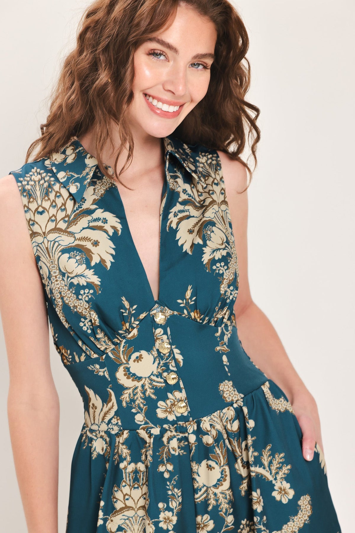 Teal floral printed sleeveless collared jumpsuit with V-neck detail
