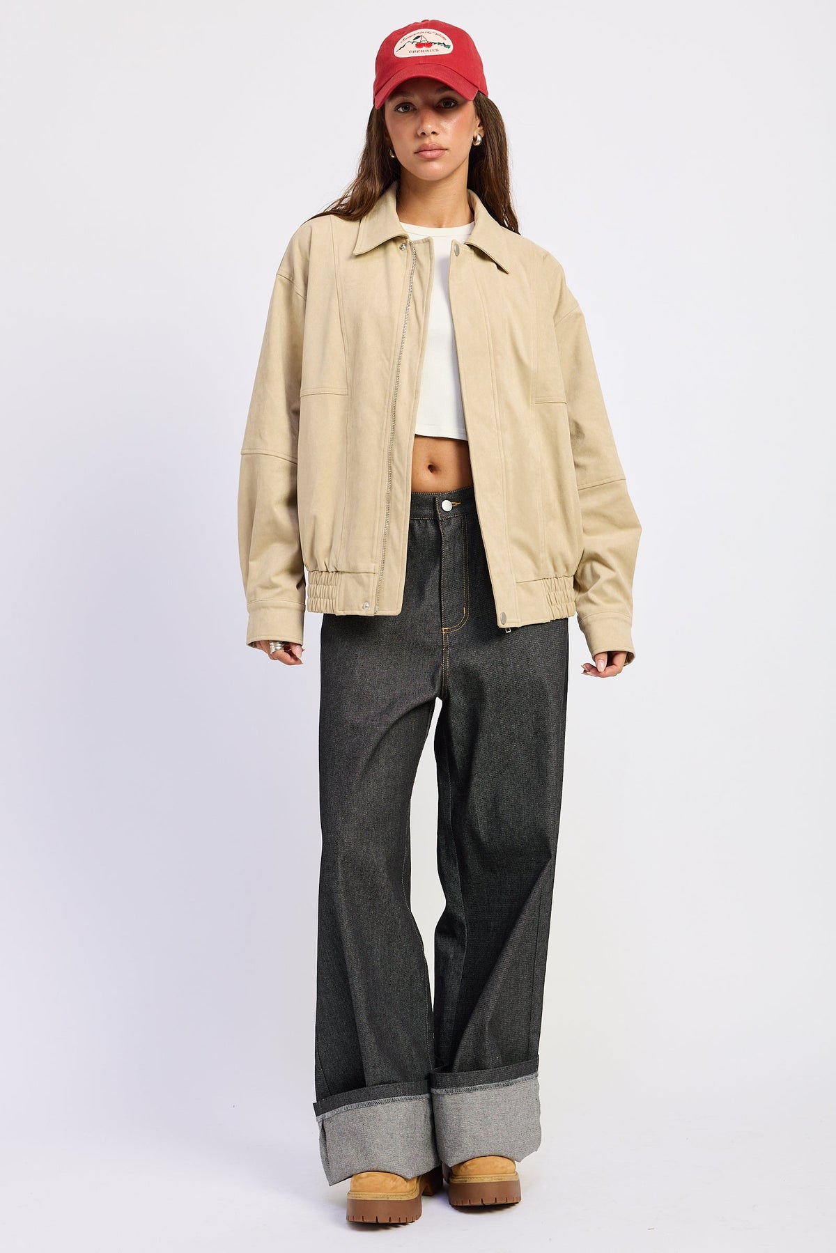 Light beige bomber jacket with snap collar, zip front, and side pockets