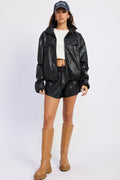 Black leather-look jacket with flap pockets and stand collar, front view