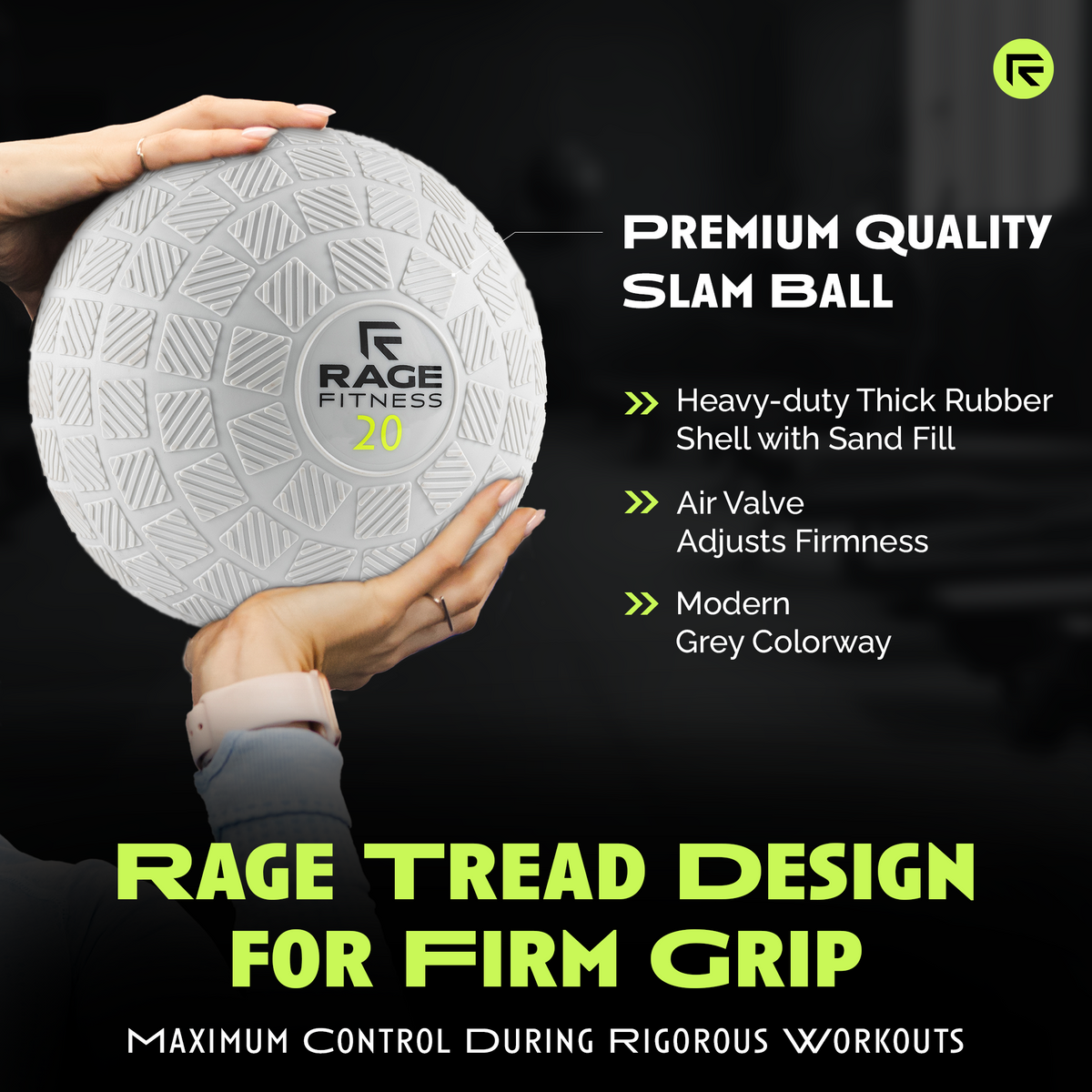 Grey slam ball with textured tread and RAGE FITNESS 20 label, held by two hands.