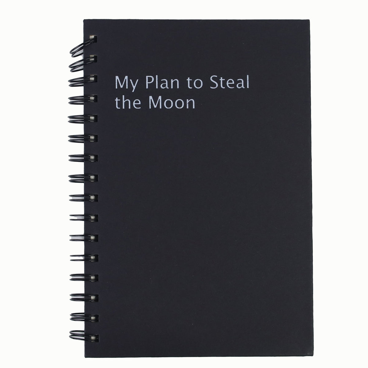 Black cover spiral notebook with "My Plan to Steal the Moon" title text