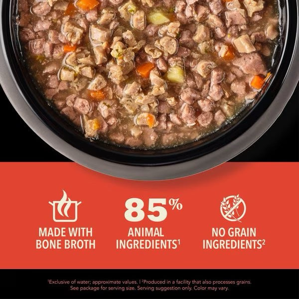 Wet cat food chunks in broth with visible beef and tuna pieces in bowl