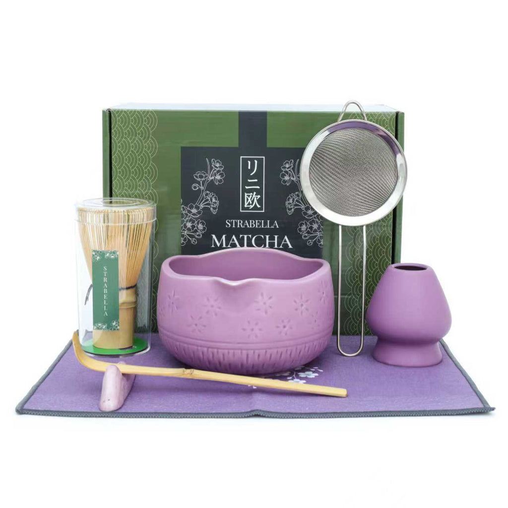 Matcha whisk set with lavender chawan bowl, bamboo whisk, metal strainer, and tray mat