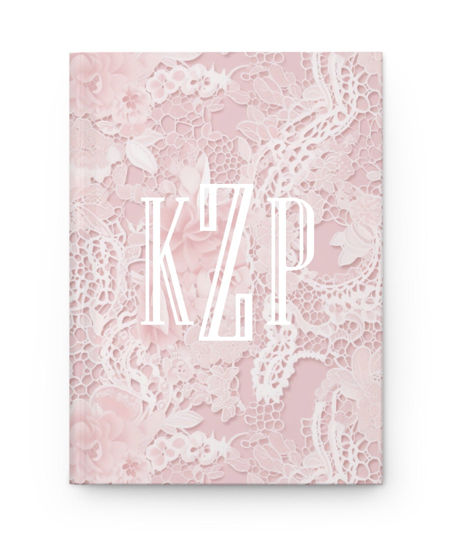 Pink floral lace hardcover journal with white monogram KLP on the cover