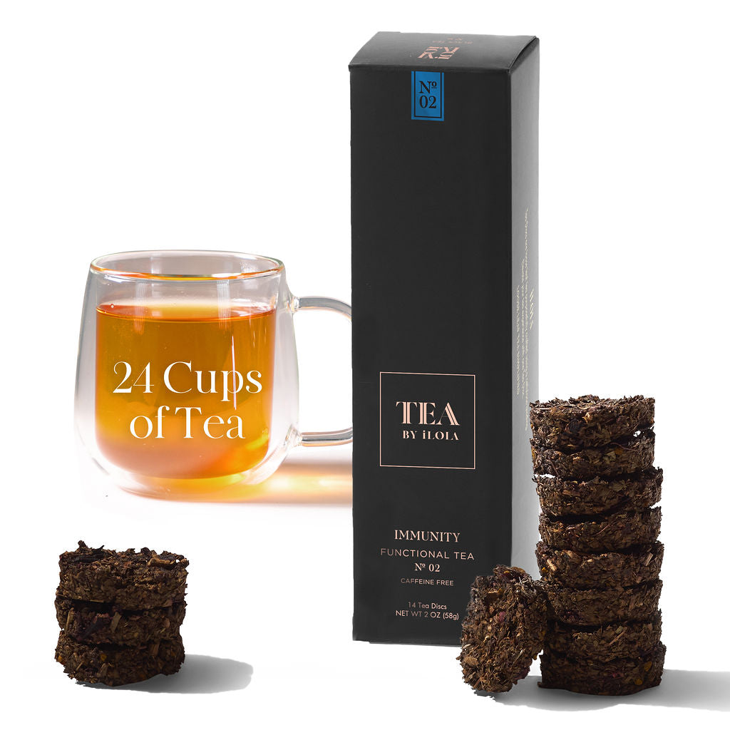 Immunity No. 02 herbal tea set with a black box, tea discs, and a glass of brewed tea