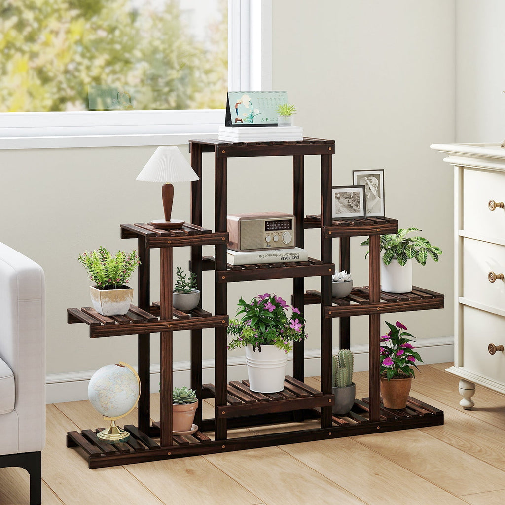 Brown multi-tier wood plant stand with open shelves and potted plants
