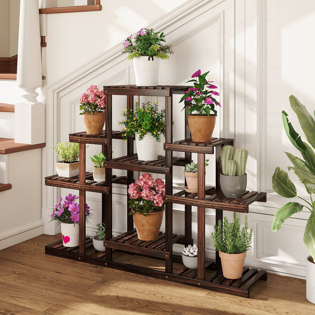 Brown multi-tier wood plant stand with shelves and potted flowers in an entry