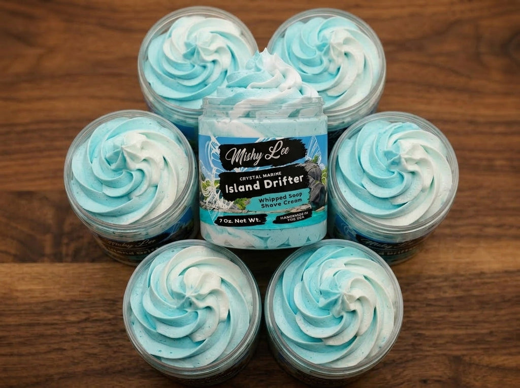 Group of small containers filled with turquoise whipped soap swirls