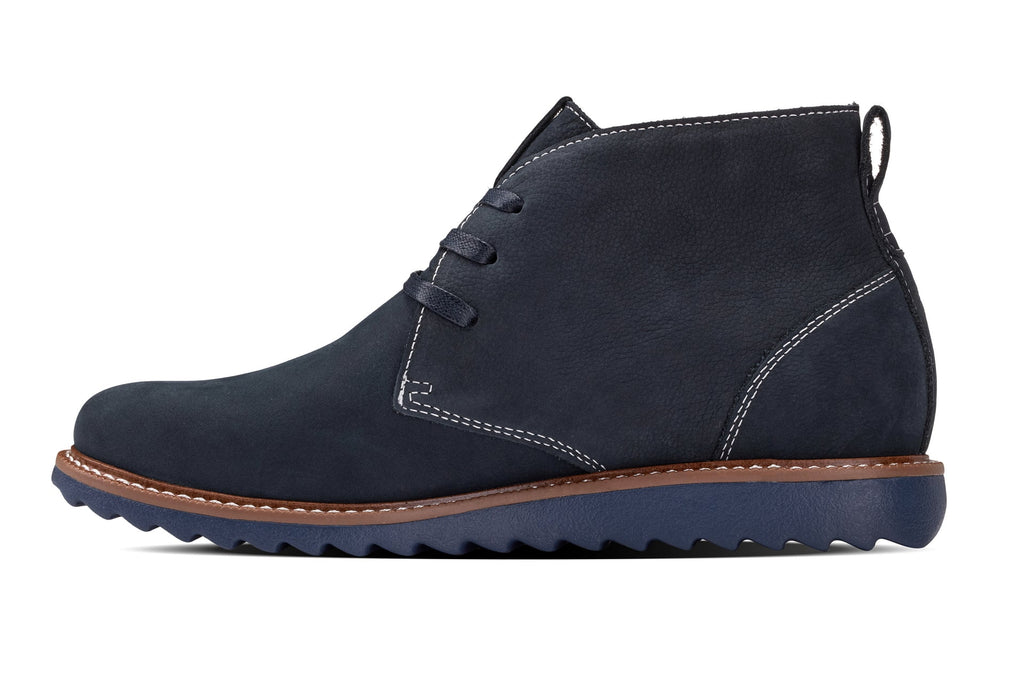 Navy nubuck chukka boot angled view with lace-up and contrast-stitched vamp