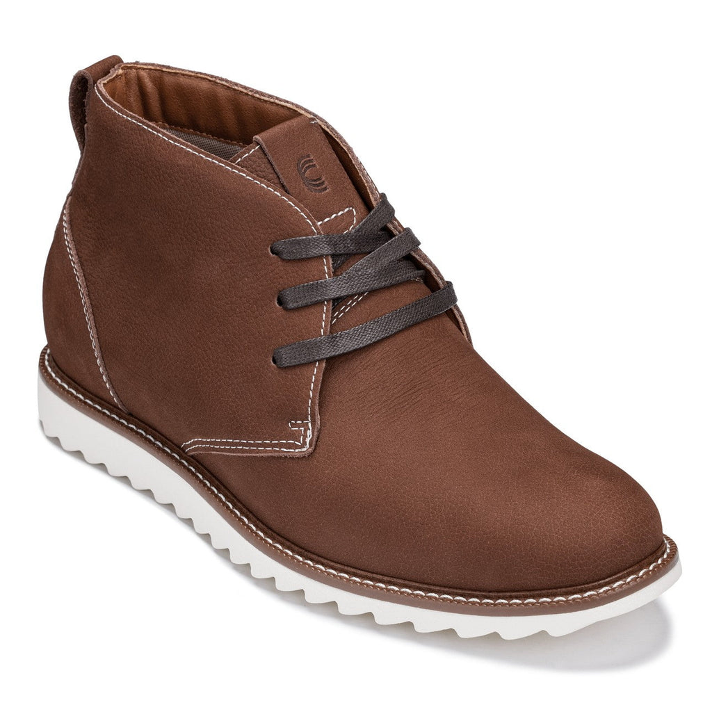 Brown nubuck chukka boots with dark lace-up and white rubber outsole