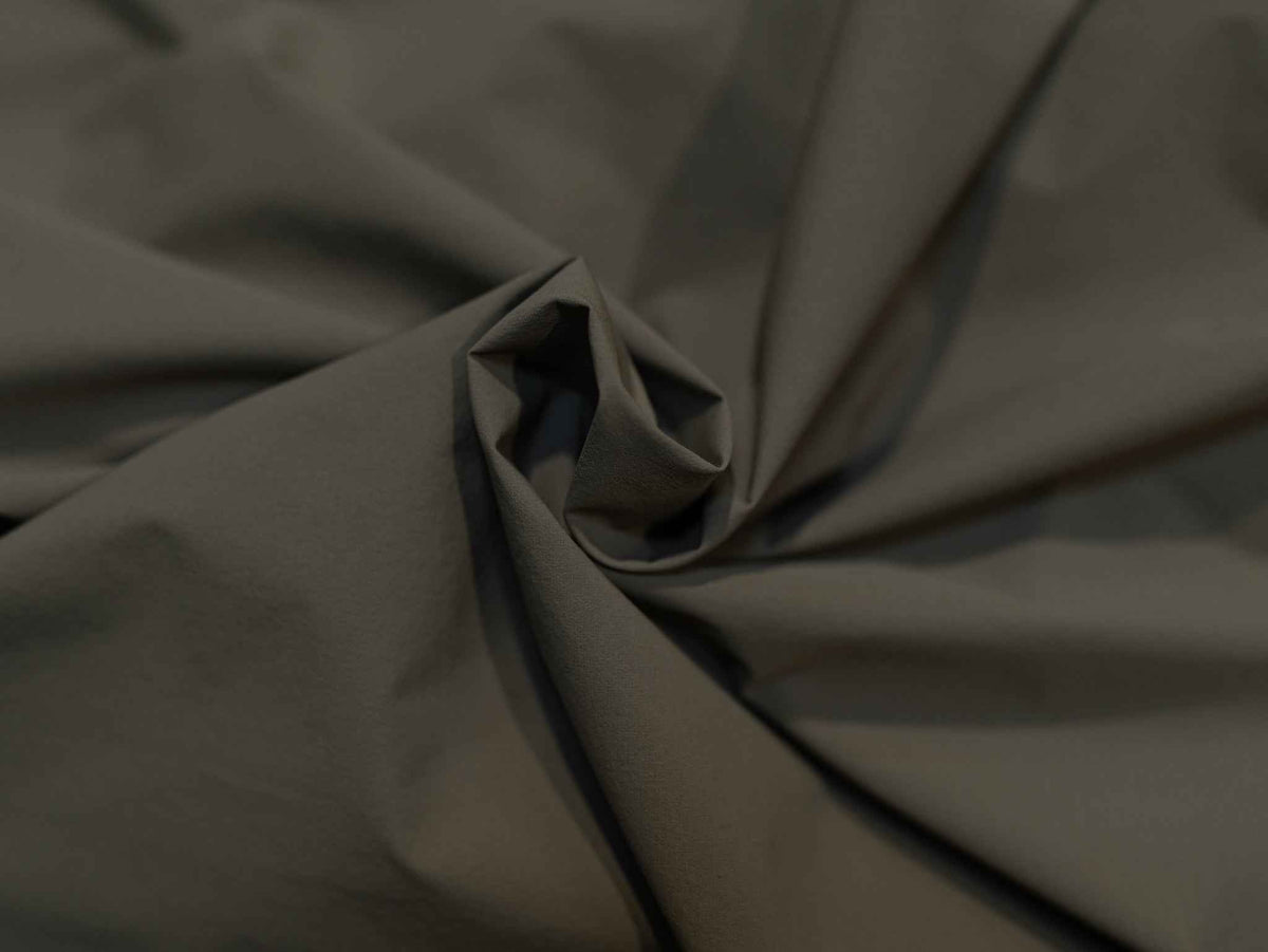 Journey jacket fabric close-up with textured weave and subtle sheen