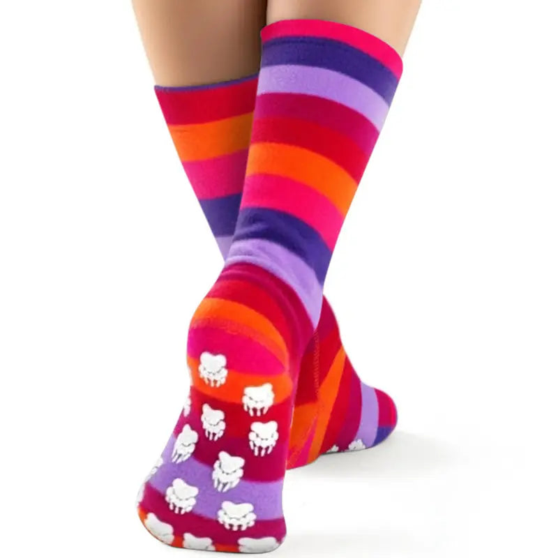 Fleece crew socks with multicolor stripes and white paw print graphic