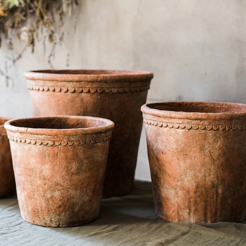 Terracotta red concrete planter pot set, scalloped rim, textured exterior