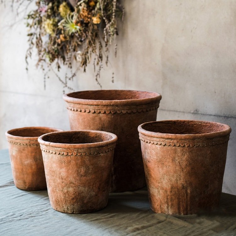 Terracotta red concrete planter pot set, scalloped rim, textured worn finish