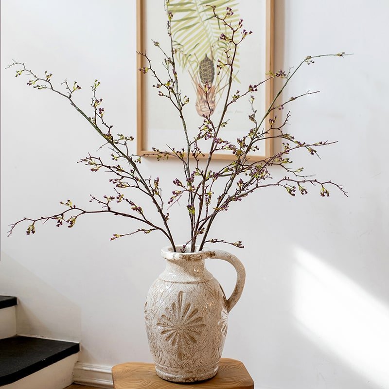Tall artificial branching flower stem with small purple-pink buds