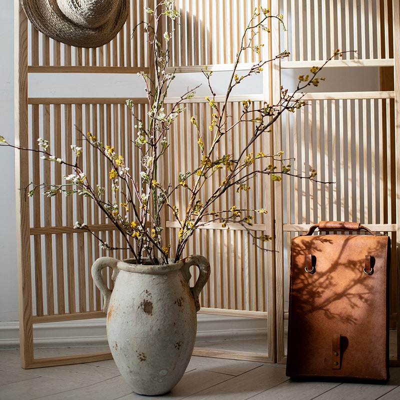 Tall artificial branching flower stem with small yellow blossoms
