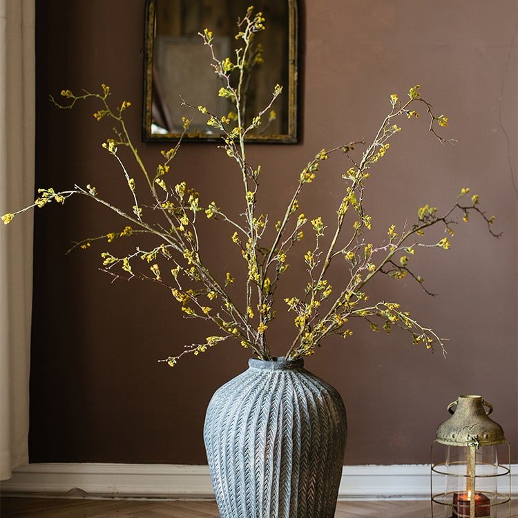 Tall artificial branching flower stem with tiny yellow blooms