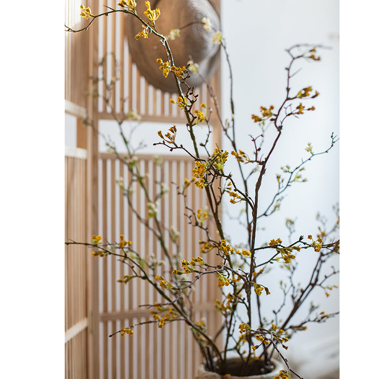 Tall artificial branching flower stem with tiny yellow blossoms