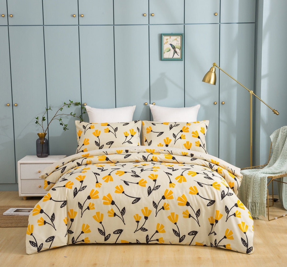 Yellow tulip floral duvet cover set with pillow shams on a bed